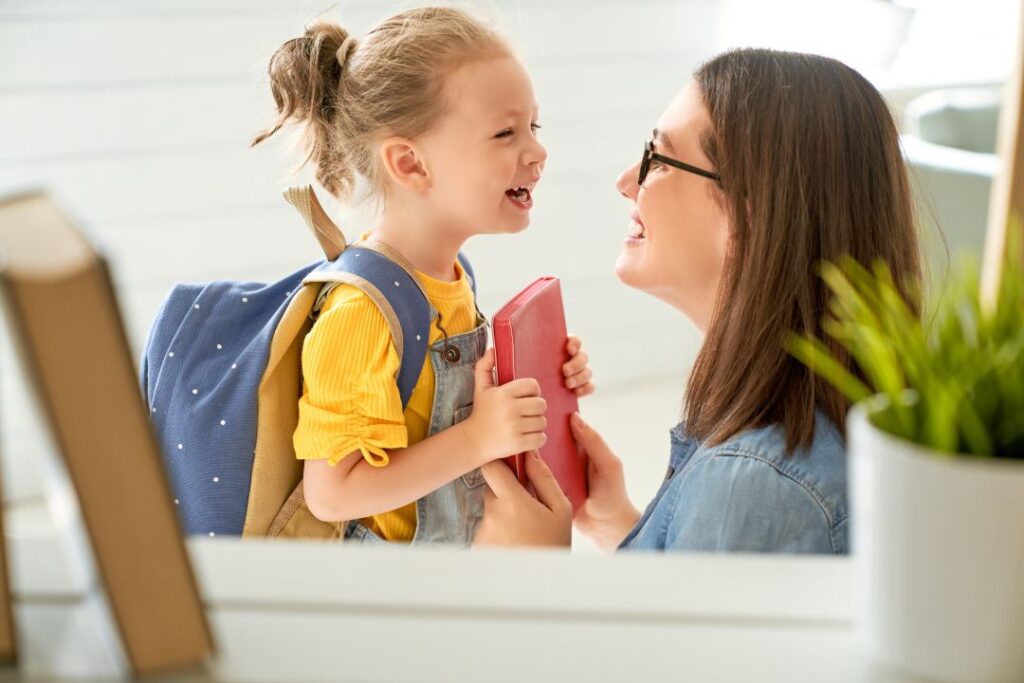 Mom and child excited about our back to school house cleaning checklist.